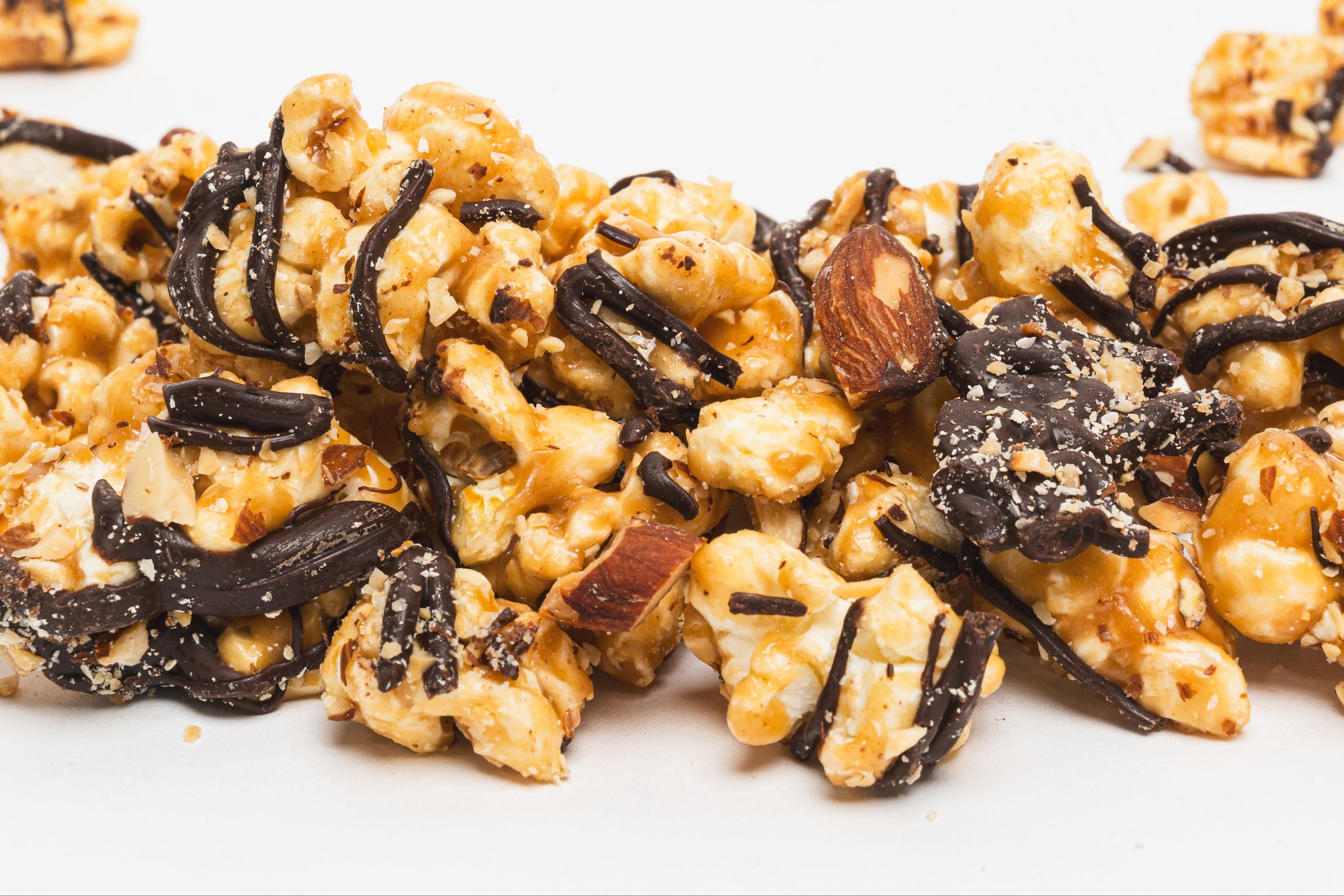 Poppin Toffee butter toffee popcorn with fine dark chocolate and roasted and chopped almonds.